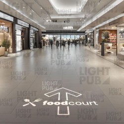 Luminous ground arrow projection for shopping center
