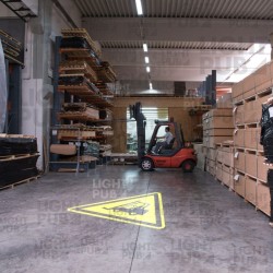 Illuminated signs to prevent forklift and pedestrian collisions